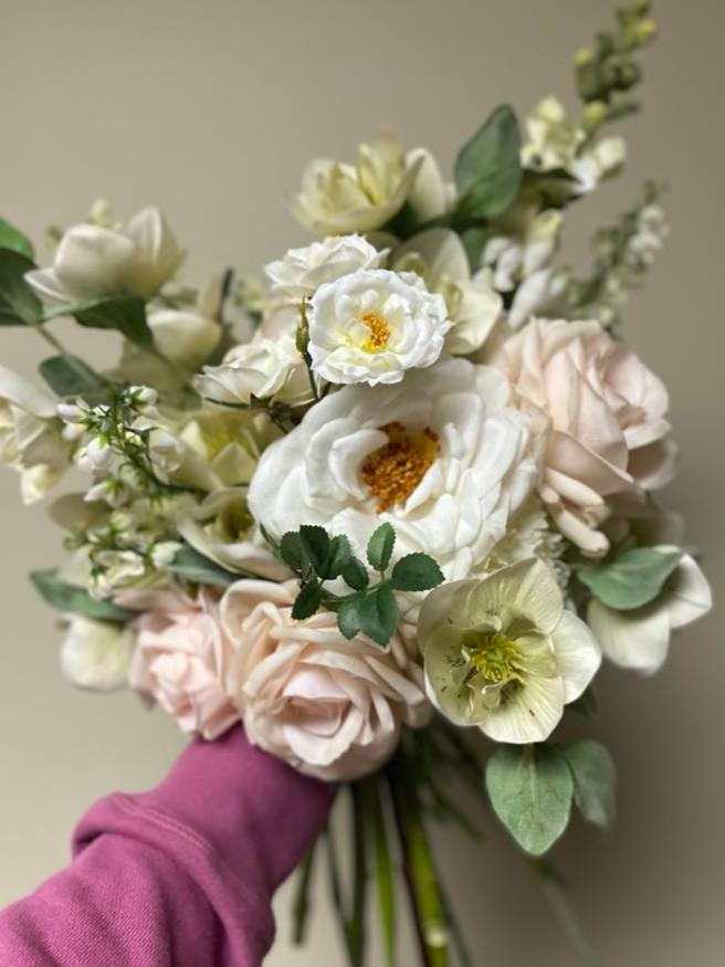 Ethereal ivory, green, blush pink and sage bouquet using artificial faux flowers including roses, hellebore, carnation and lilly of the valley by faux florist Love & Lilacs Boutique of  Edmonton Alberta