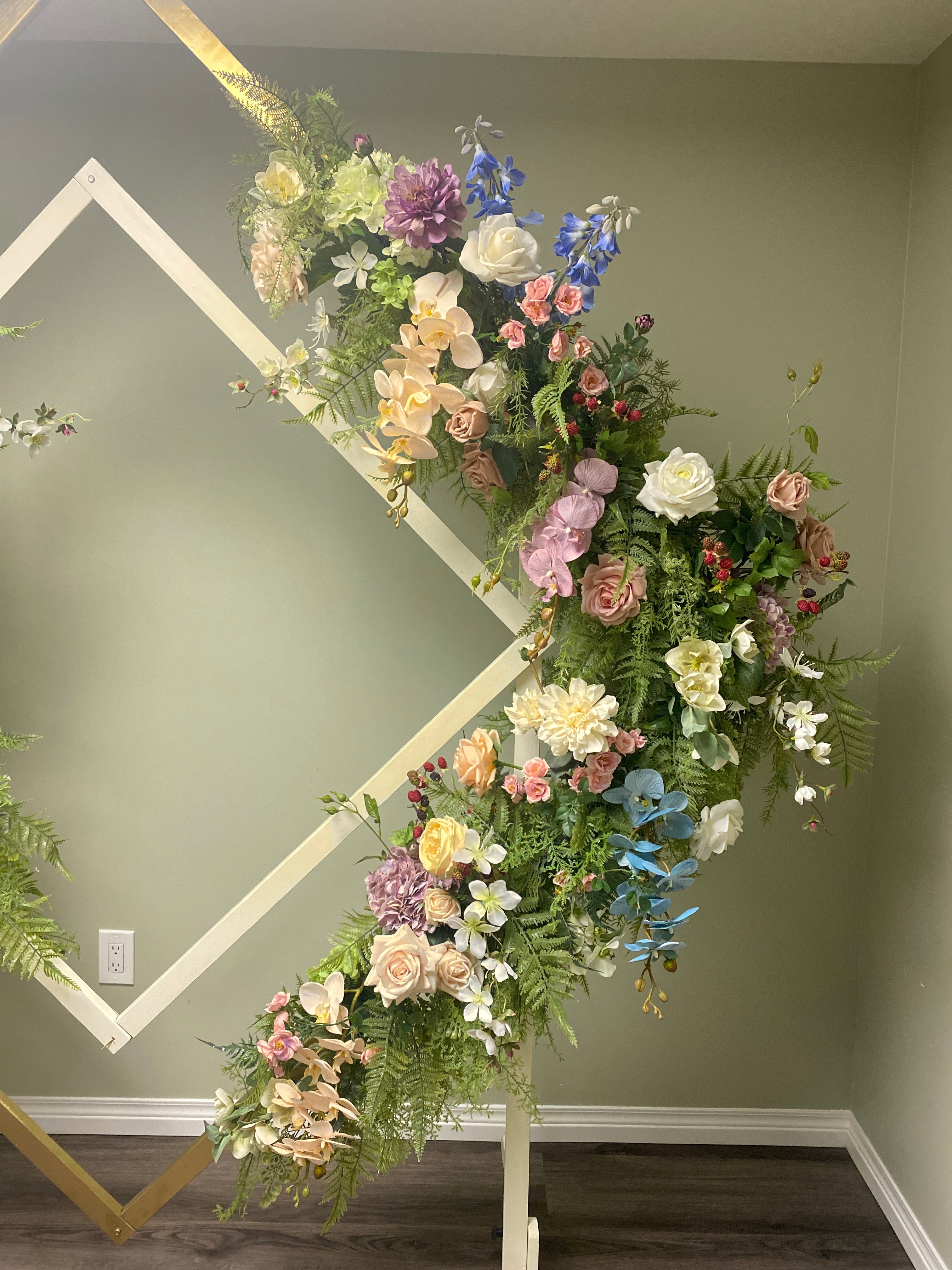 Chelsea Geometric Diamond Wedding Arch in gold and ivory with watercolour wildflower custom faux artificial wedding floral flowers on rent customized floral wedding arch for rent in Edmonton Alberta Canada 